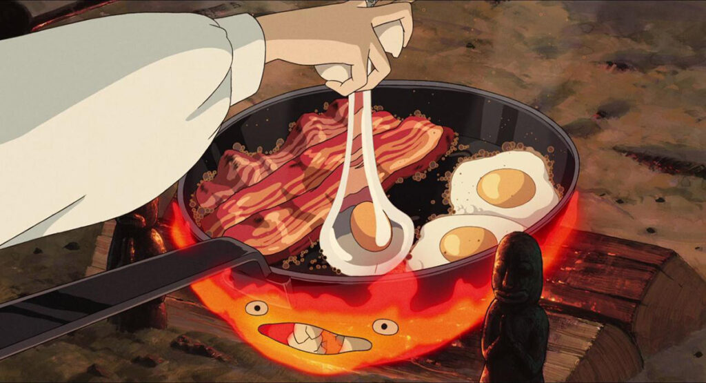 Howl cucina la colazione uova e bacon insieme a Calcifer